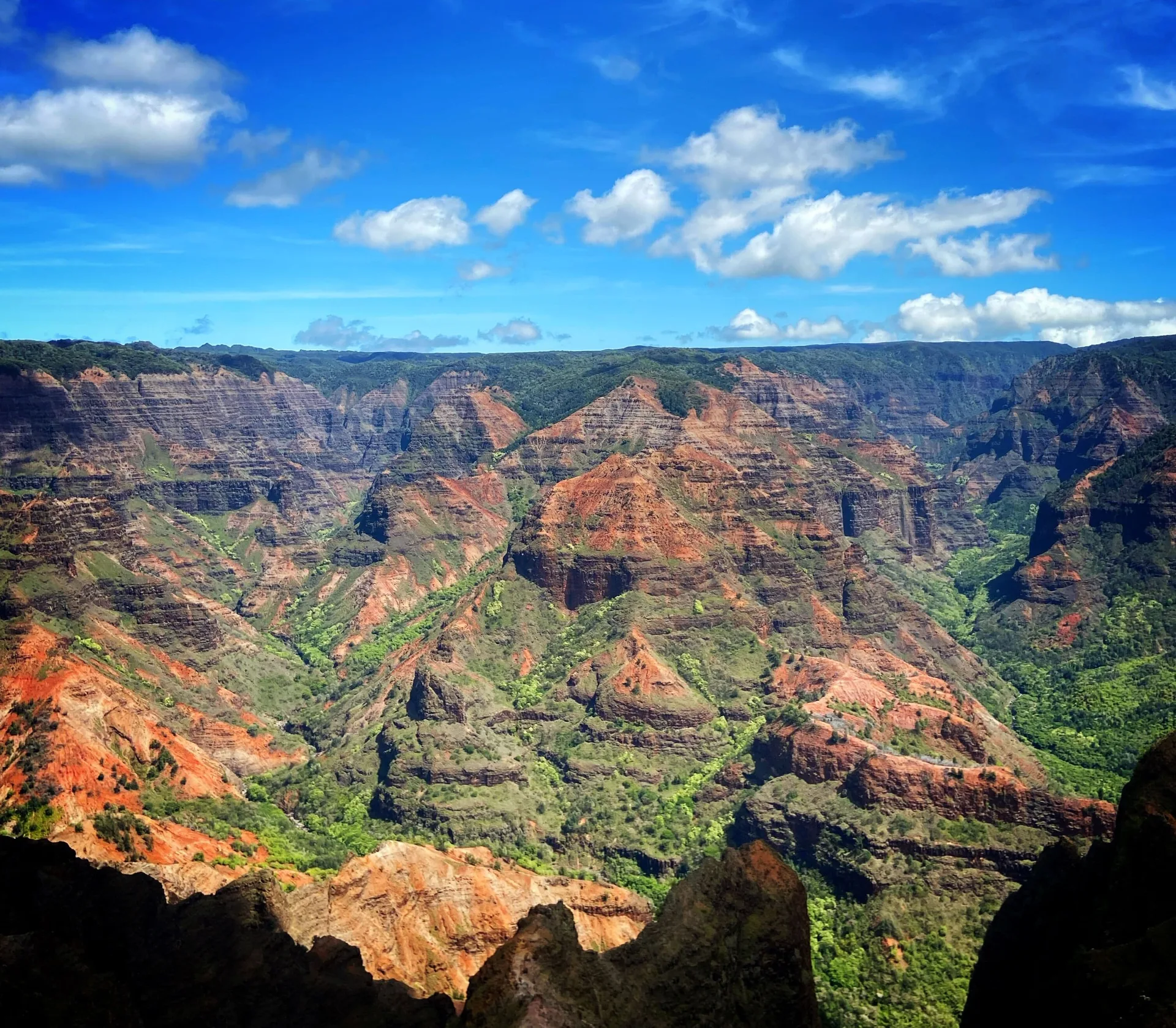 Layered red and green canyon landscape near Waimea Plantation Cottages.