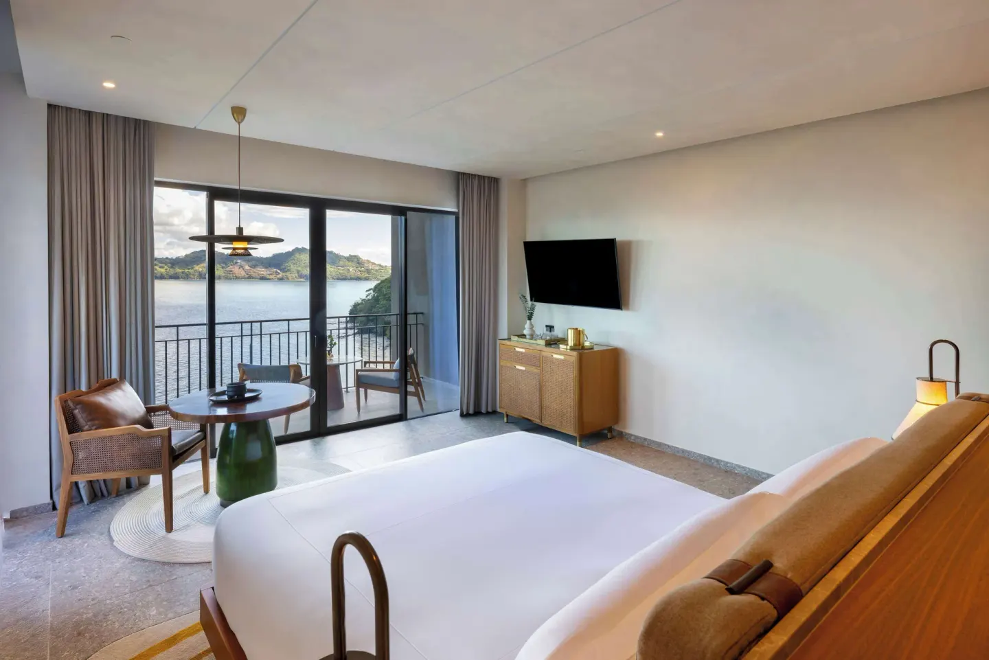 King guest room with balcony and bay view at Waldorf Astoria Costa Rica Punta Cacique.