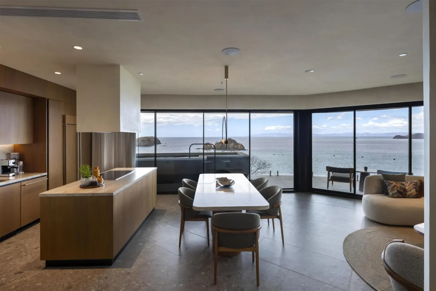 Ocean-view suite kitchen and dining area at Waldorf Astoria Costa Rica Punta Cacique.