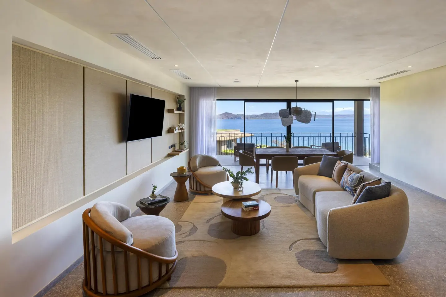 Suite living room with balcony and ocean view at Waldorf Astoria Costa Rica Punta Cacique.
