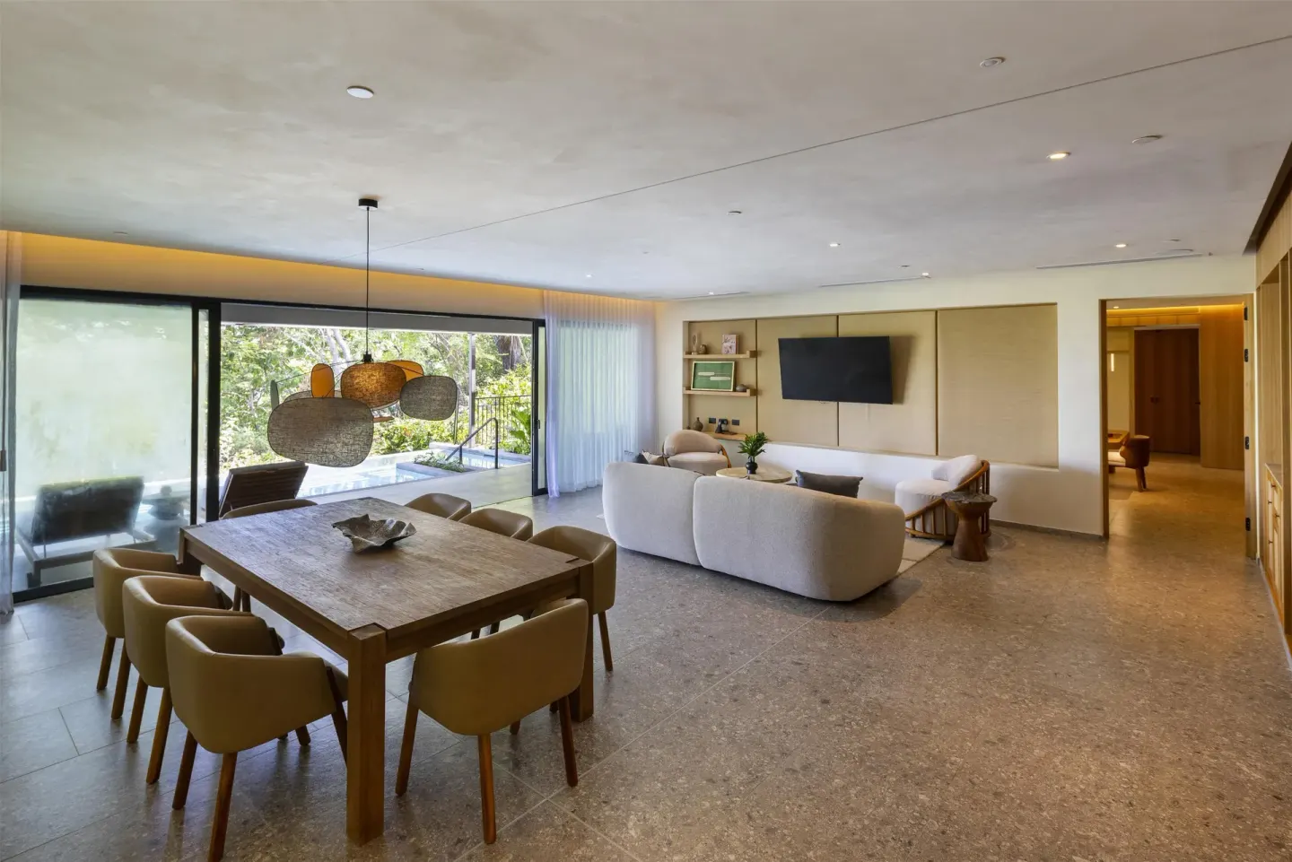 Suite dining and living room with terrace plunge pool at Waldorf Astoria Costa Rica Punta Cacique.
