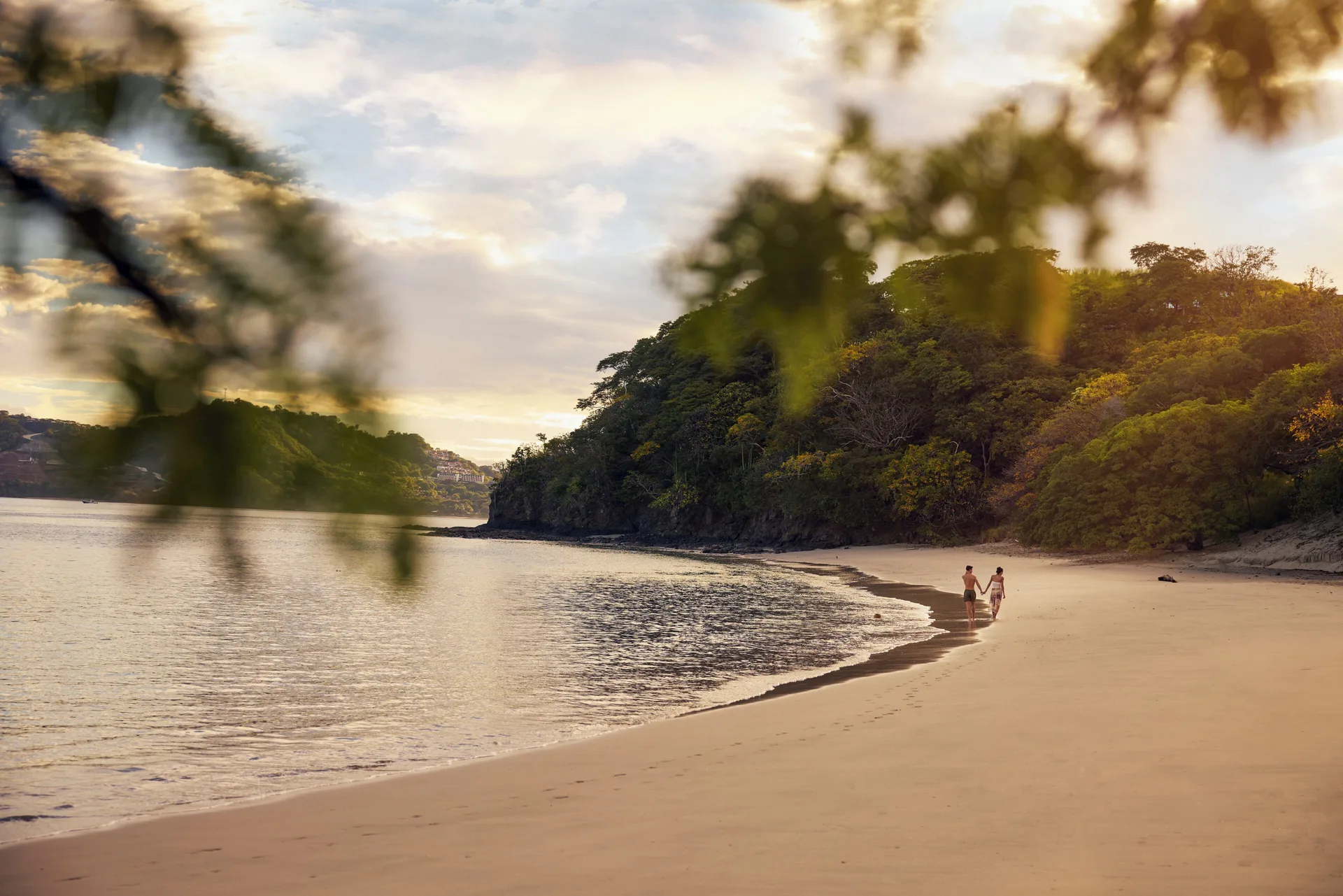 Quiet sandy beach at sunset at Waldorf Astoria Costa Rica Punta Cacique.