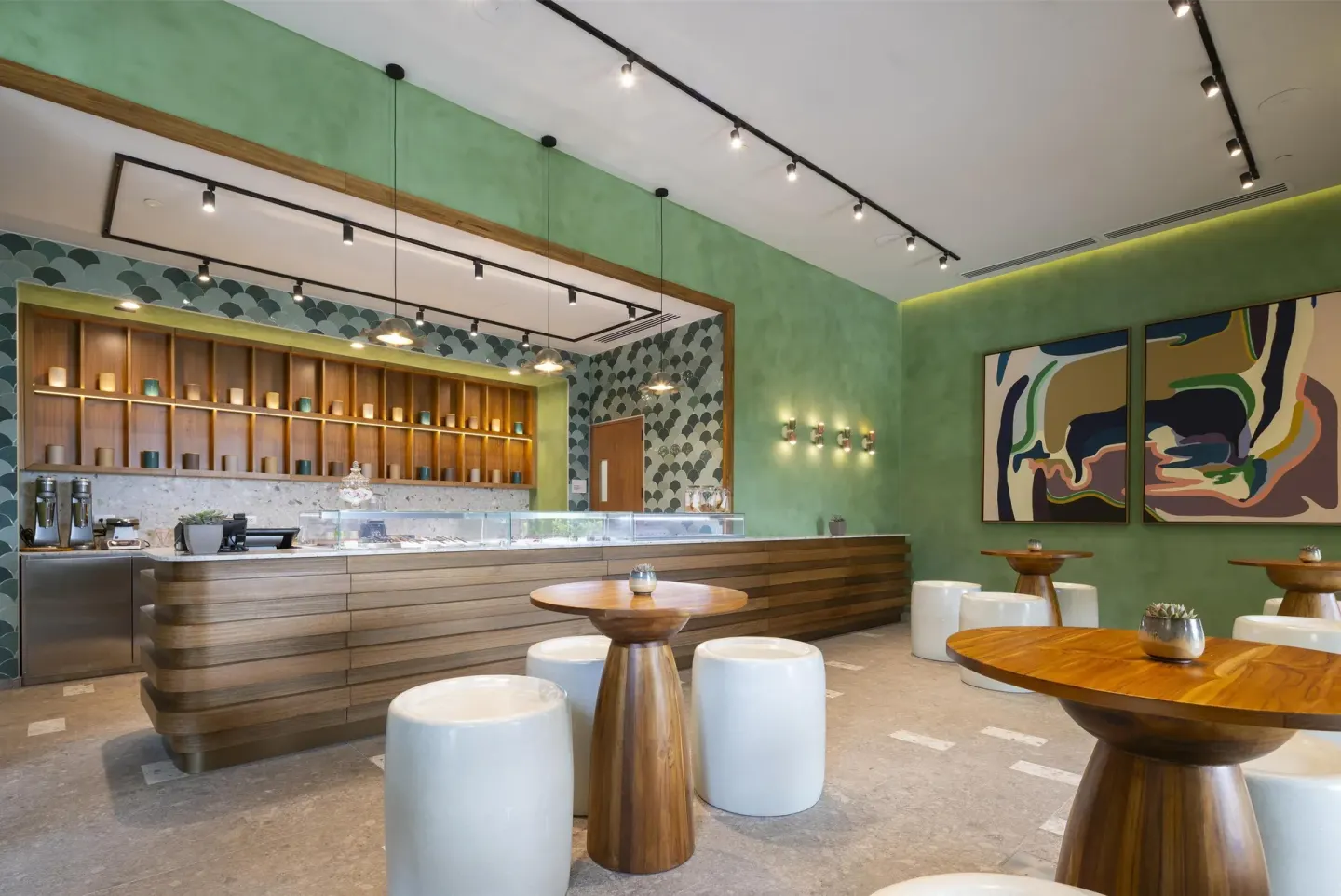 Ice cream shop with display counter and green walls at Waldorf Astoria Costa Rica Punta Cacique.