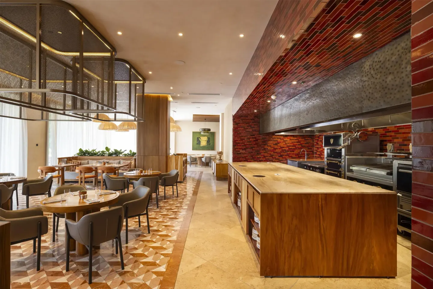 Open-kitchen restaurant interior at Waldorf Astoria Costa Rica Punta Cacique.