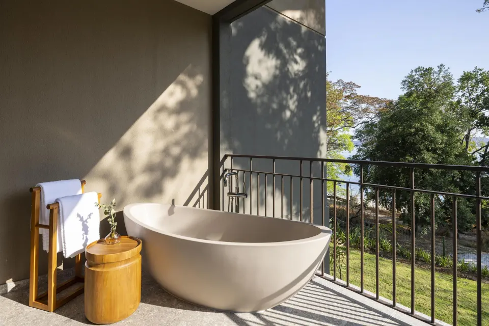 Outdoor soaking tub on the Bahia View 1 Bedroom Suite terrace at Waldorf Astoria Costa Rica Punta Cacique.