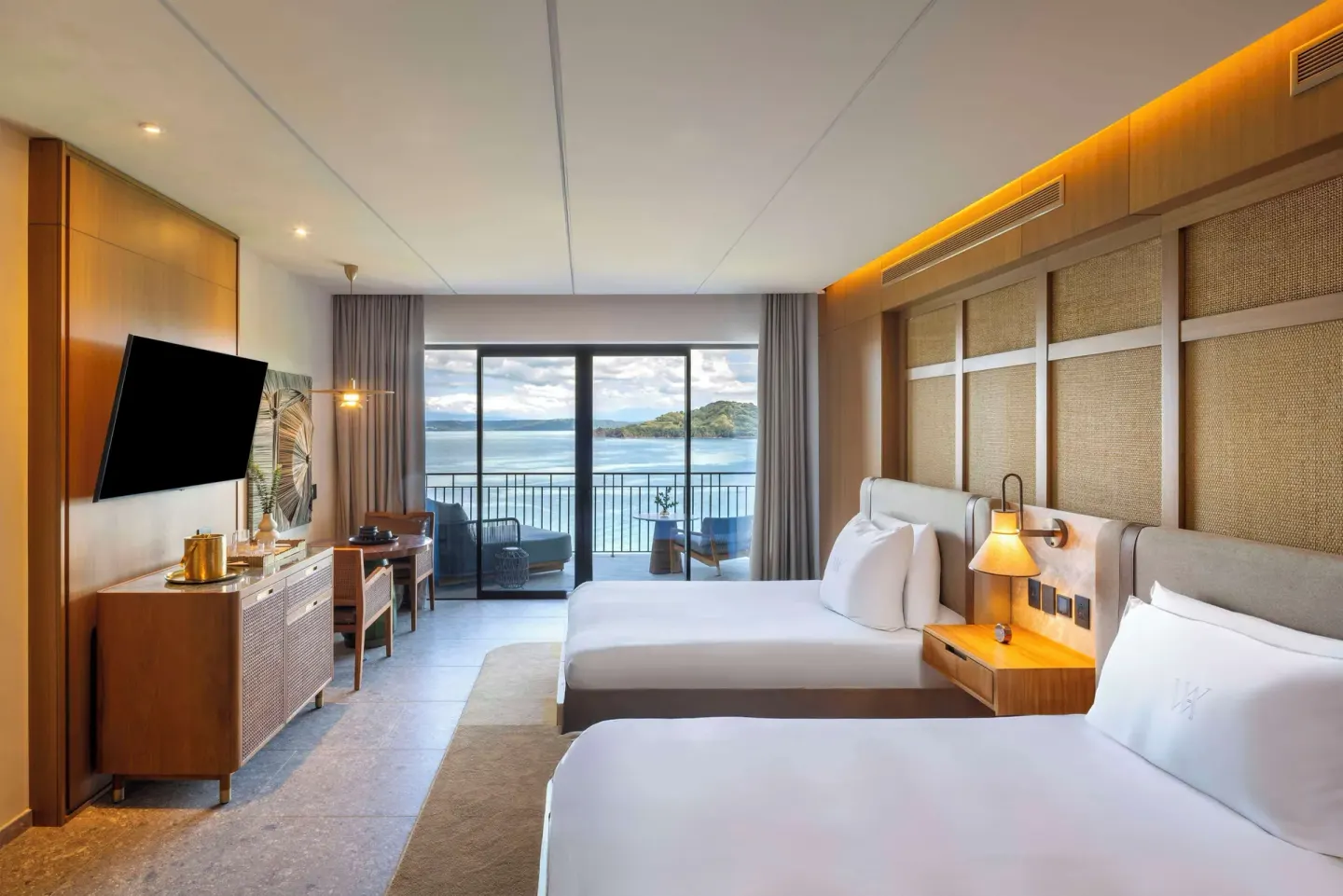 Bahia View two-queen room with balcony and water view at Waldorf Astoria Costa Rica Punta Cacique.