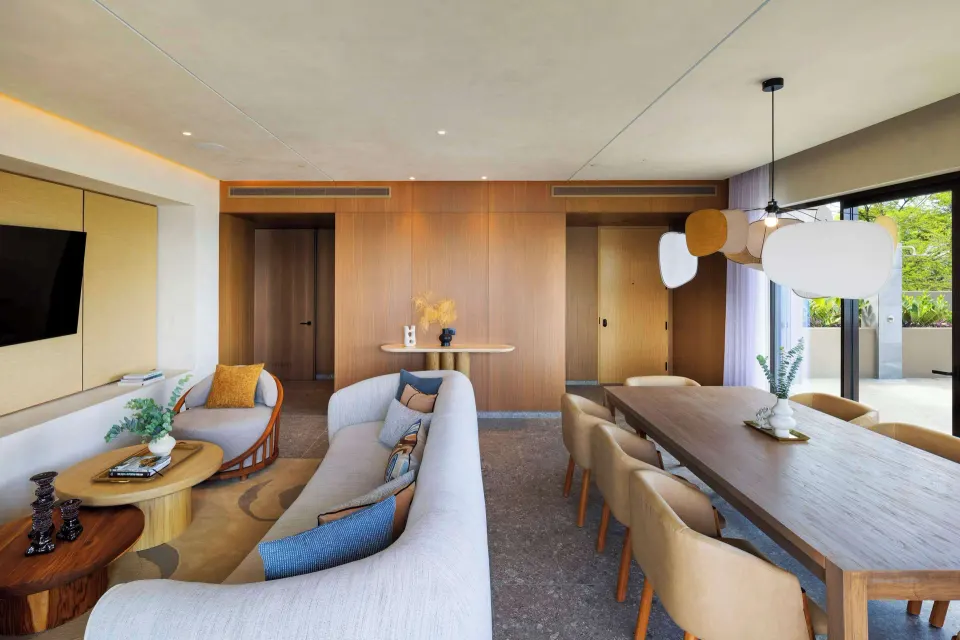 Open-plan living and dining room in a suite at Waldorf Astoria Costa Rica Punta Cacique.