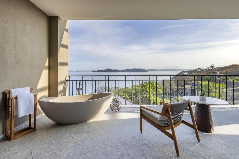 Ocean View 1 Bedroom Suite balcony with soaking tub and bay view at Waldorf Astoria Costa Rica Punta Cacique.