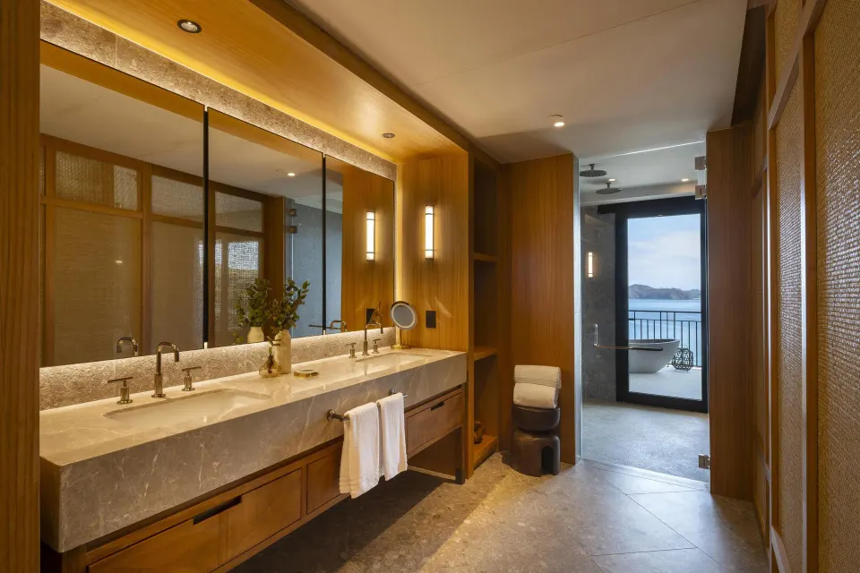 Ocean View 1 Bedroom Suite bathroom with double vanity and terrace tub at Waldorf Astoria Costa Rica Punta Cacique.