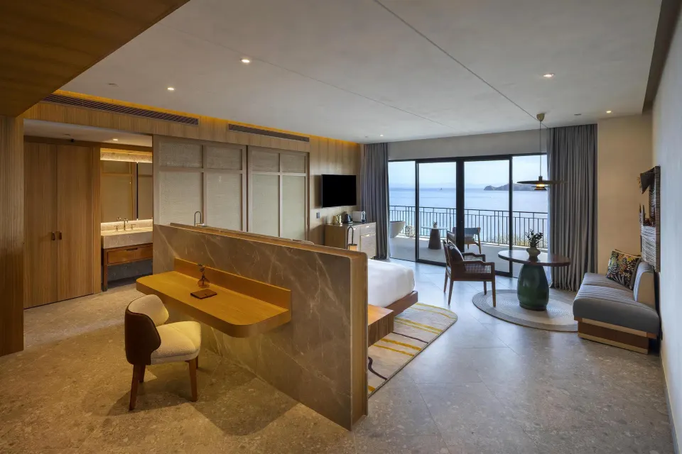 Ocean View 1 Bedroom Suite with bed, desk, sitting area, and balcony at Waldorf Astoria Costa Rica Punta Cacique.