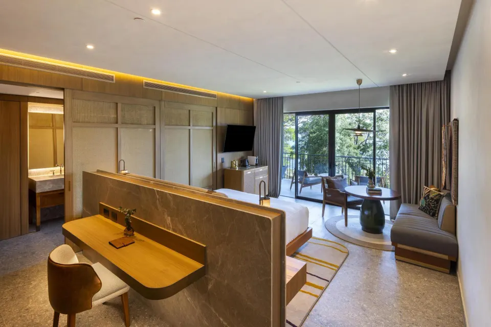 Ocean View 1 Room with desk, king bed, balcony doors, and seating at Waldorf Astoria Costa Rica Punta Cacique.