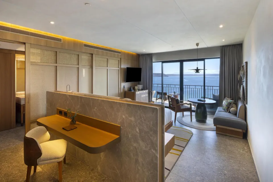 Ocean View 1 Room with king bed, desk, seating, and ocean-facing balcony at Waldorf Astoria Costa Rica Punta Cacique.