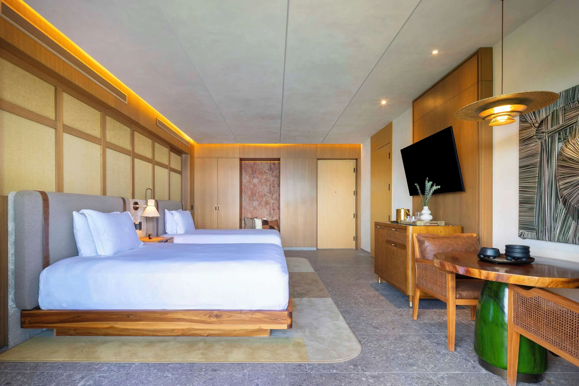Ocean View 2 Queens Room with two queen beds and wood furnishings at Waldorf Astoria Costa Rica Punta Cacique.