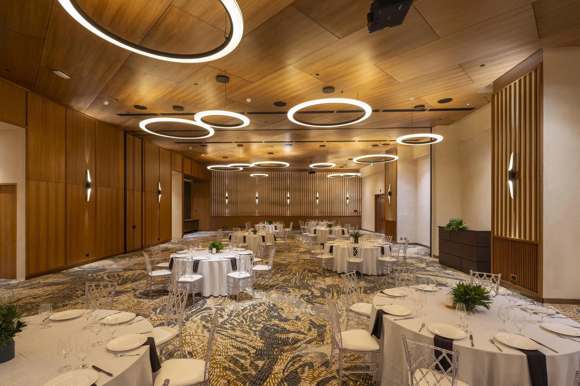 Banquet room with round dining tables at Waldorf Astoria Costa Rica Punta Cacique.