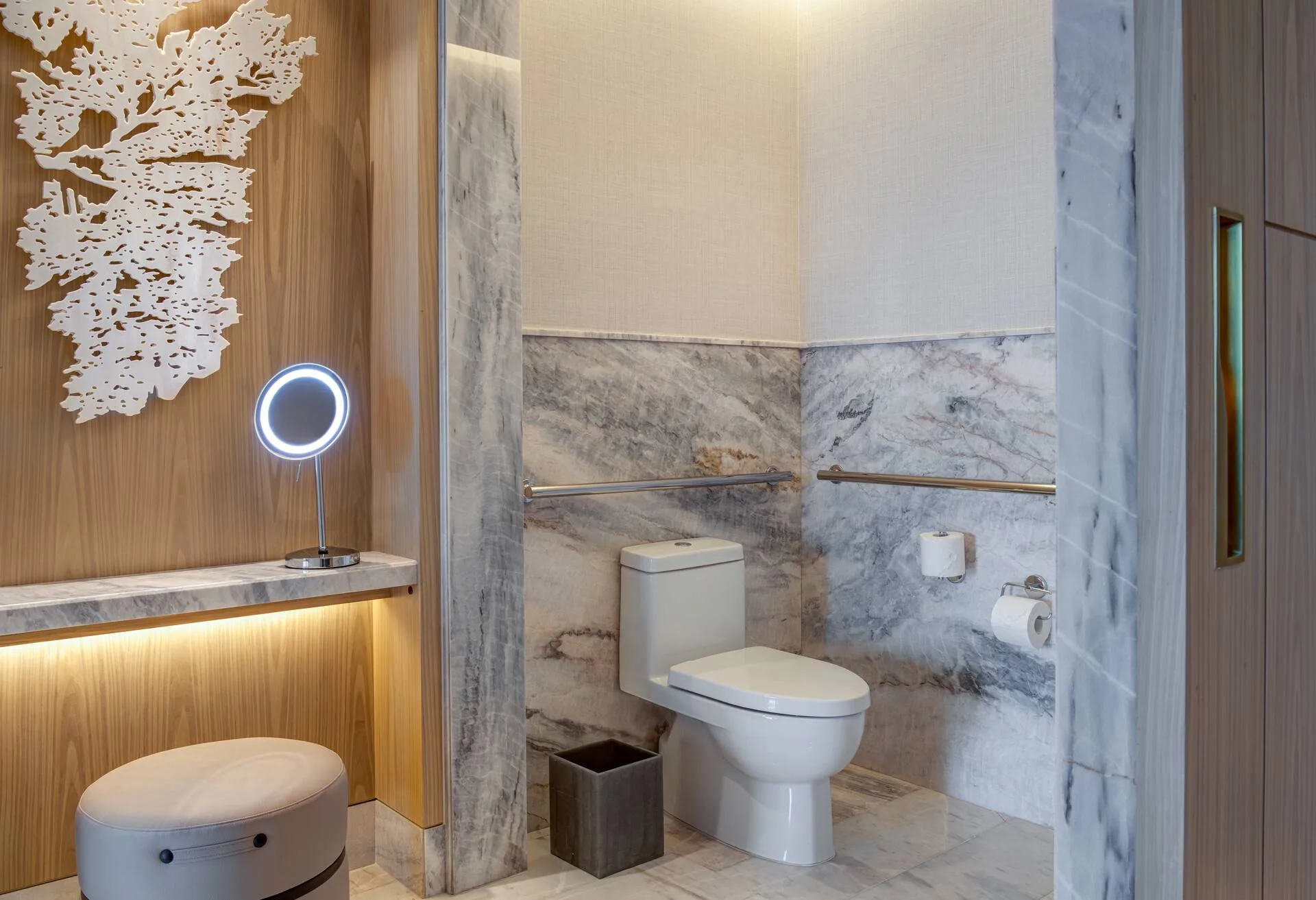 Accessible bathroom with grab bars in a guest room at Waldorf Astoria Riviera Maya.