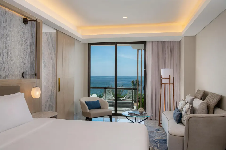 Presidential Suite bedroom with ocean-facing balcony at Waldorf Astoria Riviera Maya.