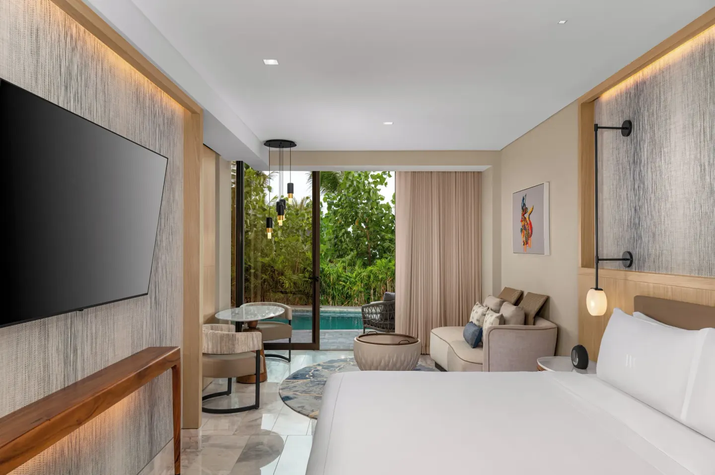 King swim-up guest room with sitting area and pool access at Waldorf Astoria Riviera Maya.