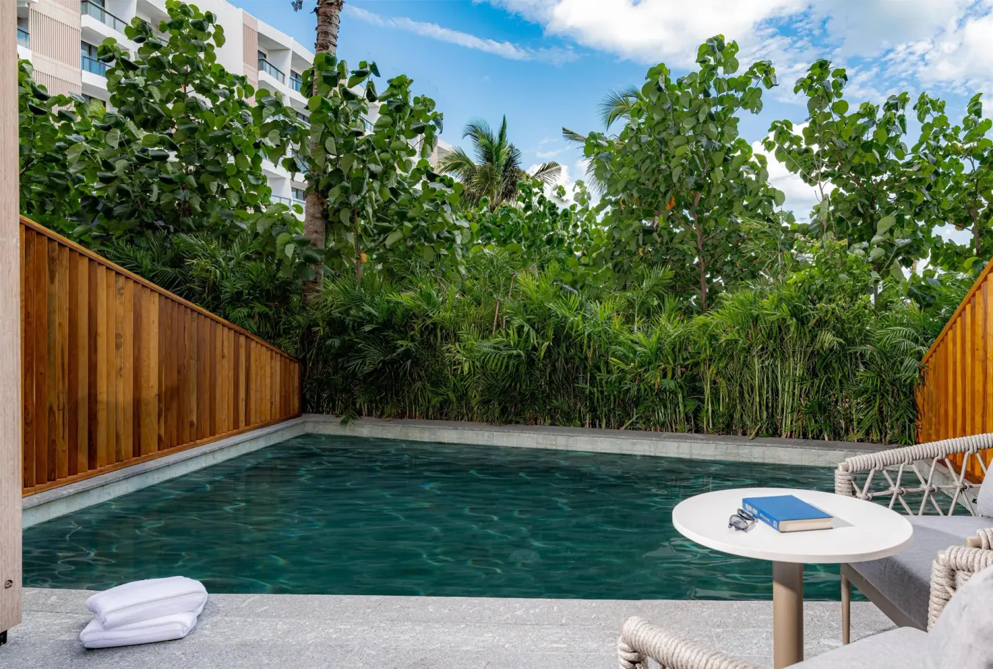 Private swim-up pool terrace with seating at Waldorf Astoria Riviera Maya.