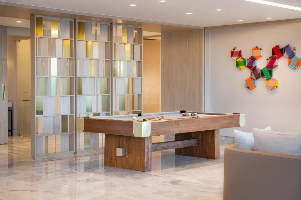 Corner ocean view suite game area with pool table at Waldorf Astoria Riviera Maya.