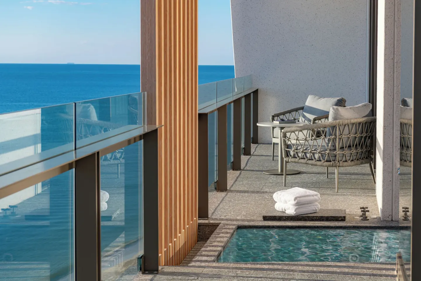 Ocean-view terrace with plunge pool for a Corner Suite at Waldorf Astoria Riviera Maya.