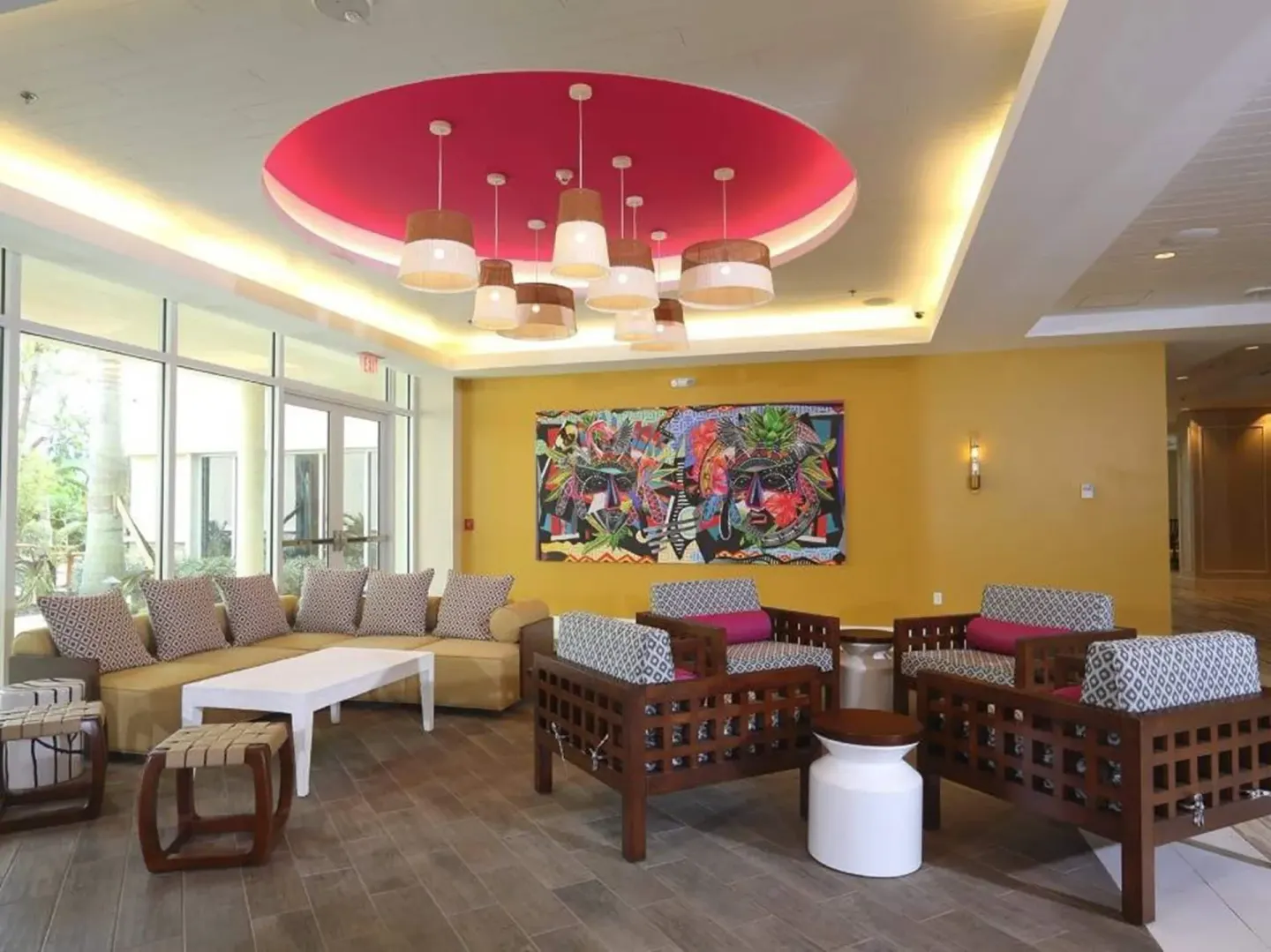 Lounge seating with patterned chairs and bold wall art at Warwick Paradise Island.
