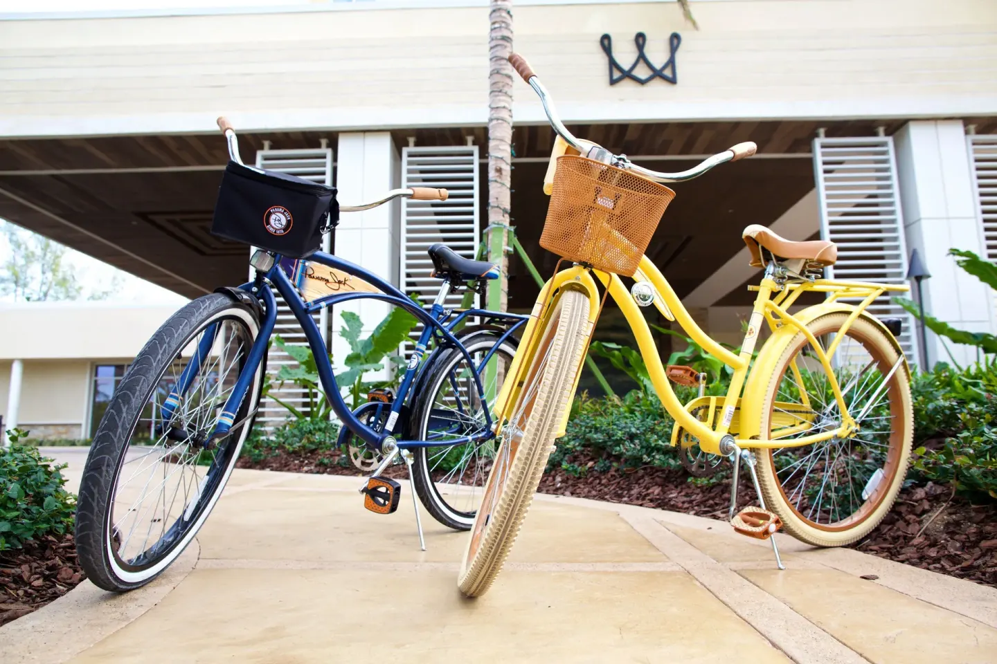 Two cruiser bicycles parked by the resort walkway at Warwick Paradise Island.