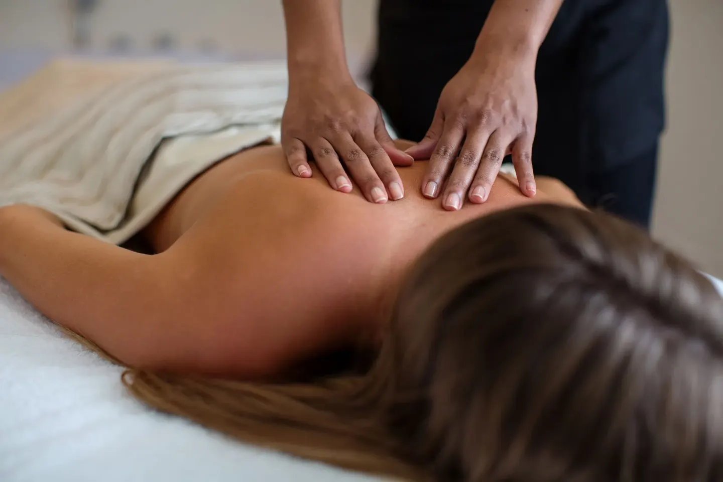 A massage treatment in progress on a spa table at Warwick Paradise Island.