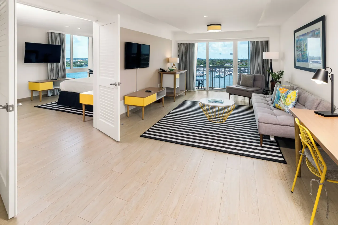 One Bedroom Harbourfront Suite living room and king bedroom at Warwick Paradise Island.