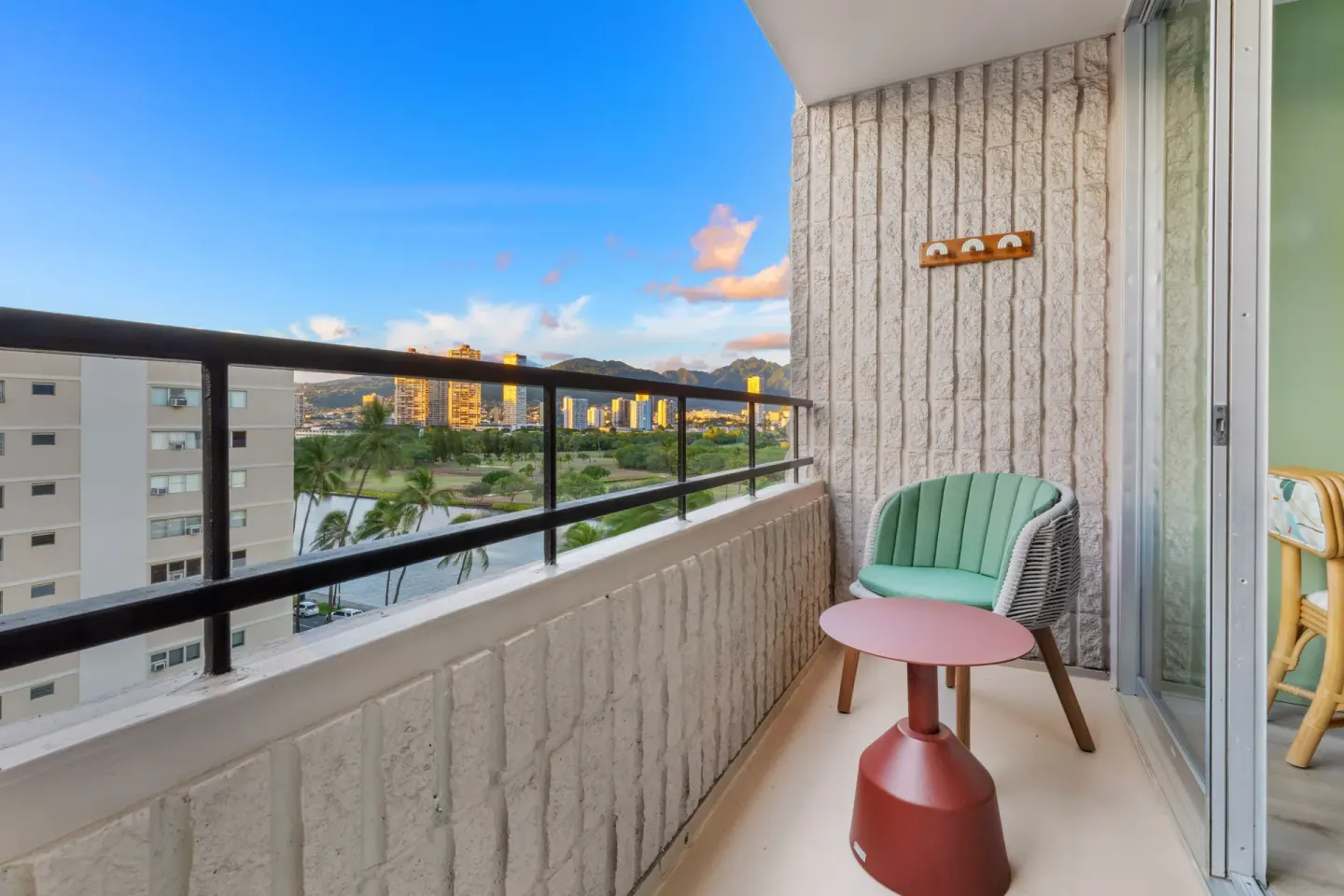 Guest balcony seating with skyline and mountain views at Wayfinder Waikiki.