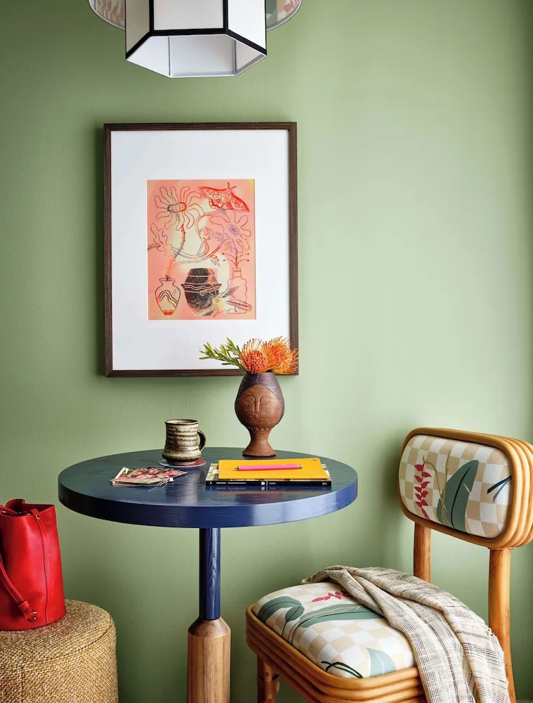 Lanai Corner guest room table and patterned chair at Wayfinder Waikiki.