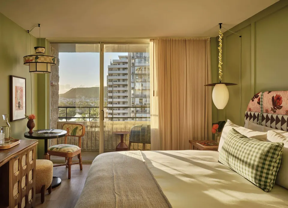Premium Room king bed with balcony and mountain view at Wayfinder Waikiki.