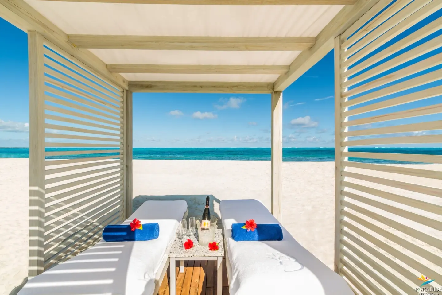 Beach spa cabana with two massage tables facing the ocean at West Bay Club.