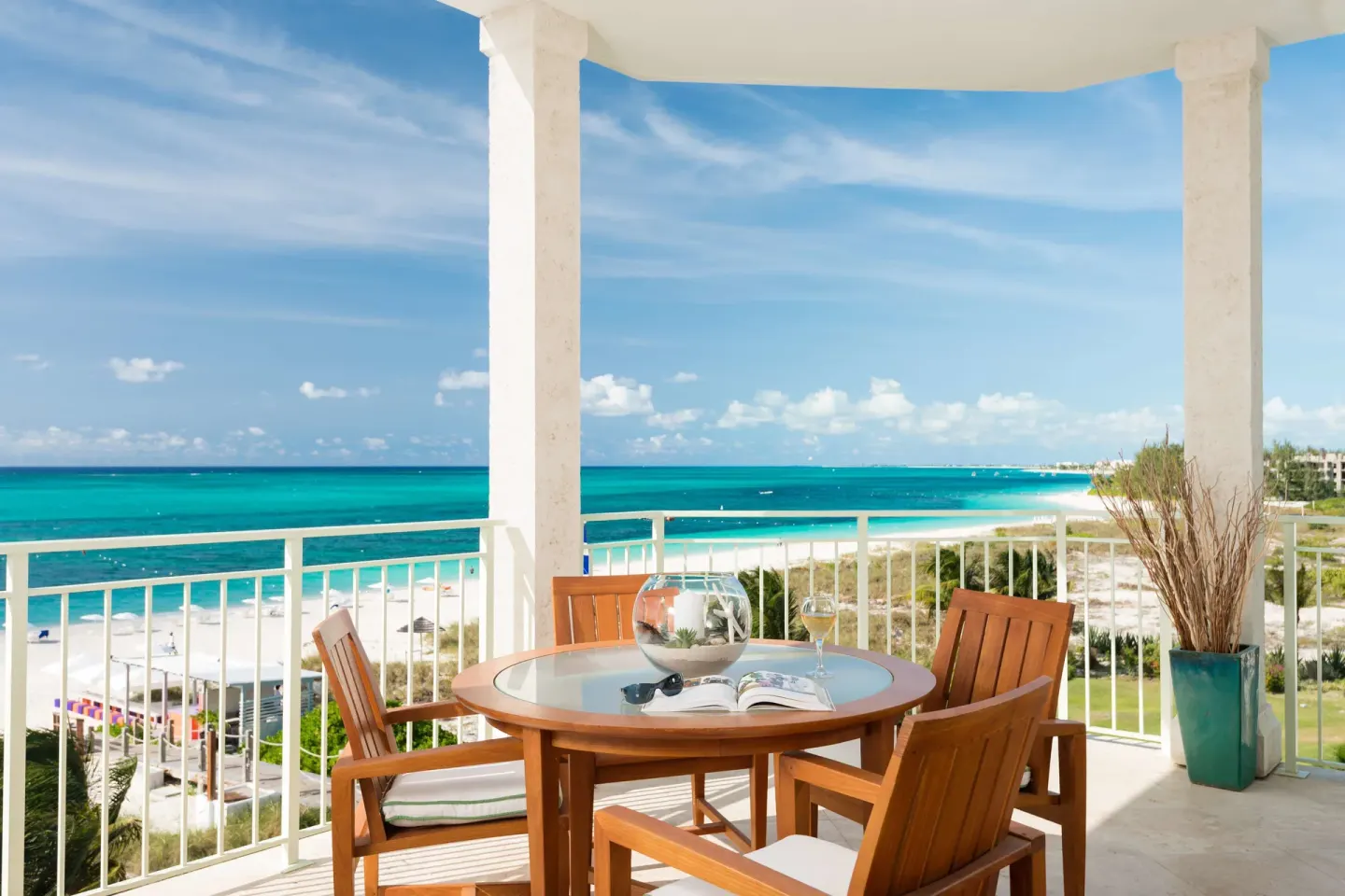 Balcony dining table overlooking the beach and ocean at West Bay Club.