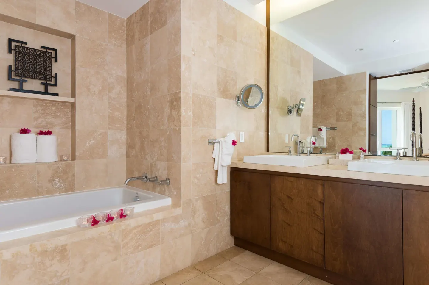 Studio Garden View bathroom with bathtub and double vanity at West Bay Club.