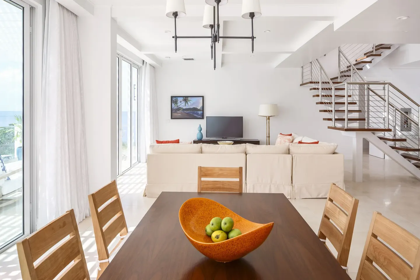 Guest residence dining area and living room stairs at Windjammer Landing Resort and Residences.