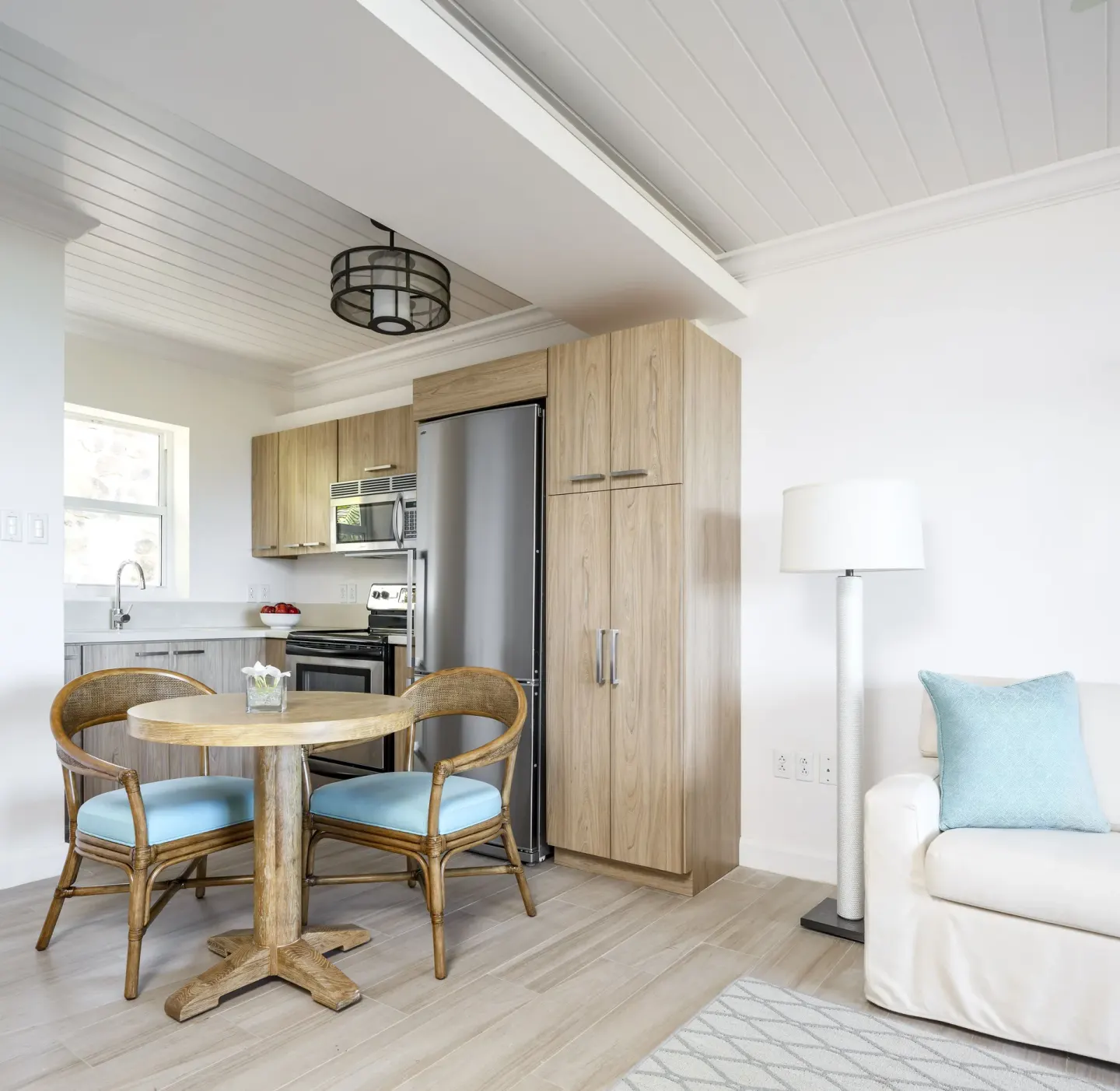 Bright guest suite kitchen and sitting area at Windjammer Landing Resort and Residences.