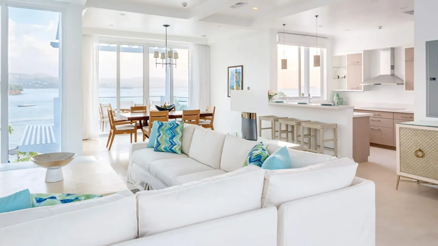 Ocean-view guest residence living and dining area at Windjammer Landing Resort and Residences.