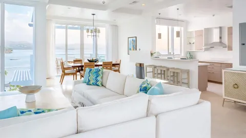 Ocean-view guest residence living and dining area at Windjammer Landing Resort and Residences.