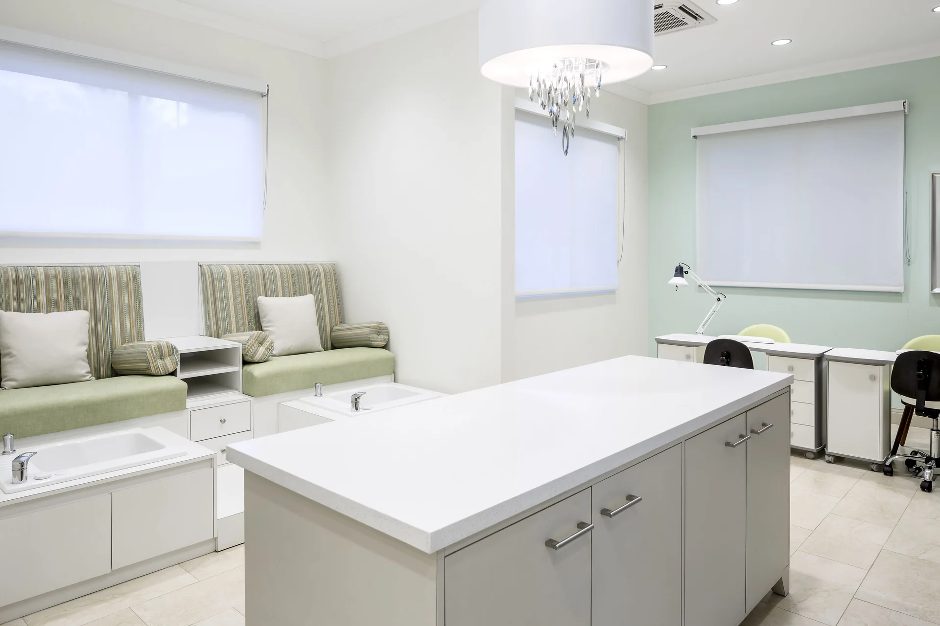 A spa manicure and pedicure room with lounge chairs at Windjammer Landing Resort and Residences.