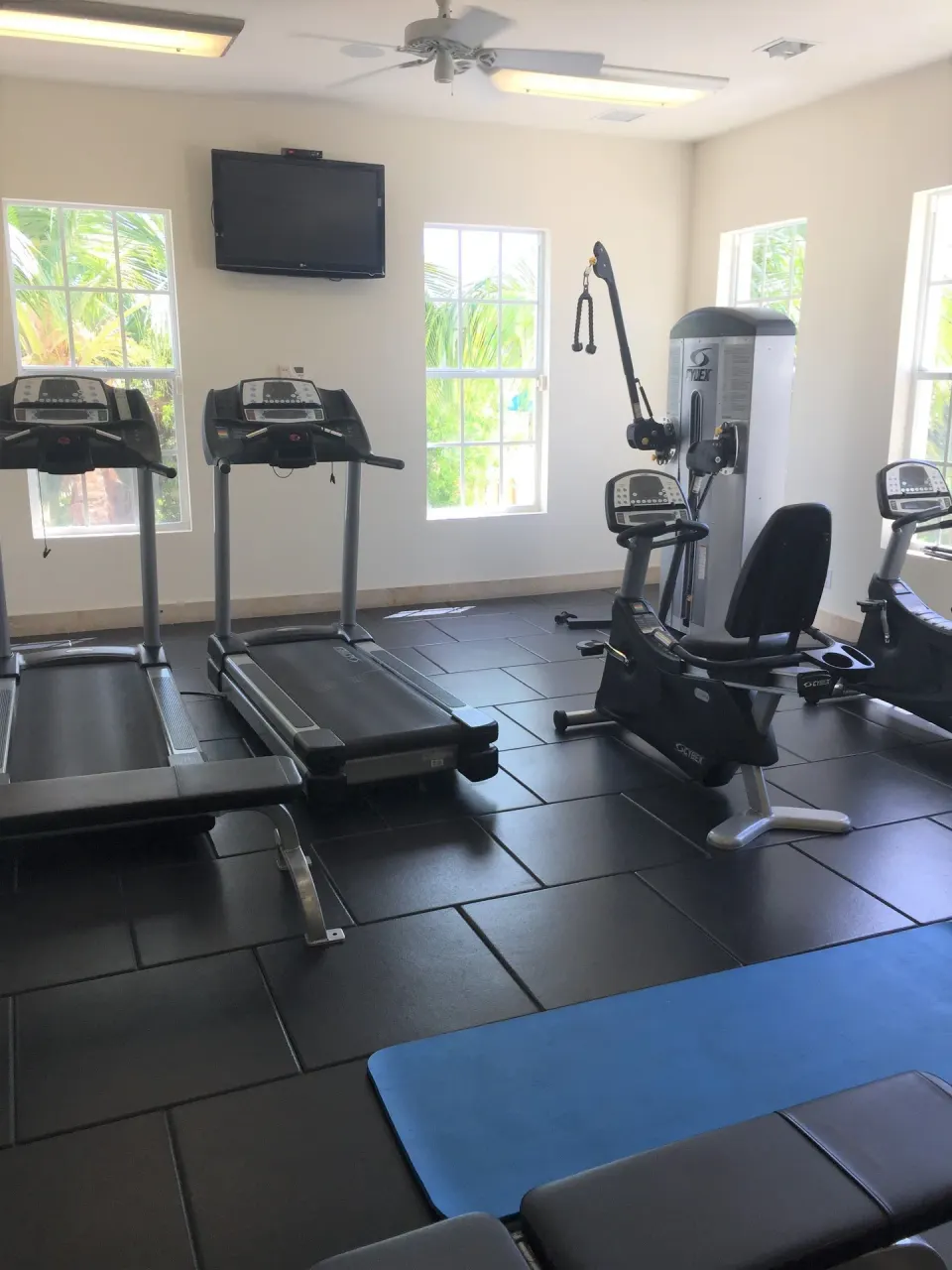 Fitness room with treadmills and exercise machines at Windsong on the Reef.