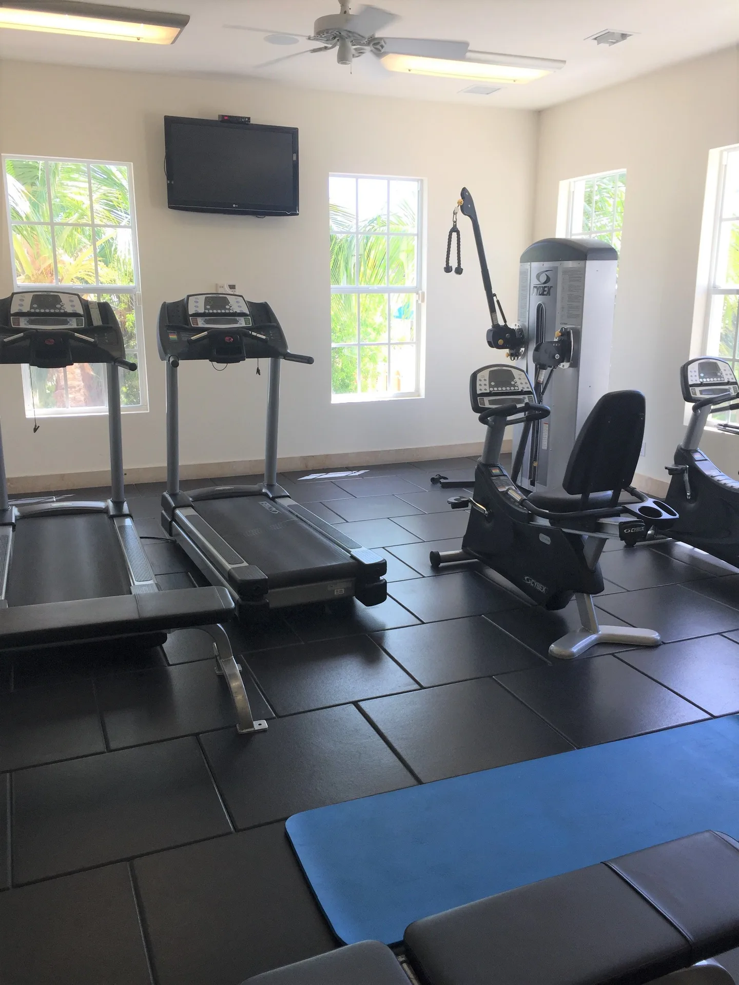Fitness room with treadmills and exercise machines at Windsong on the Reef.