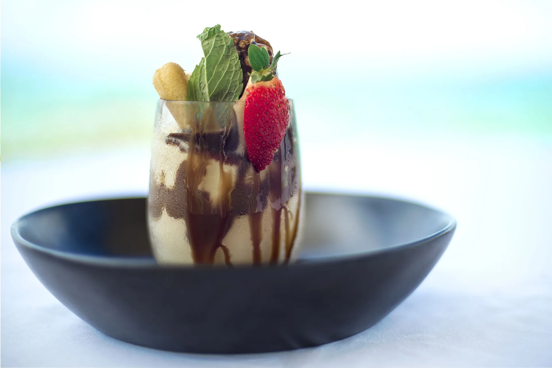 Dessert sundae with fruit garnish served at Windsong on the Reef.