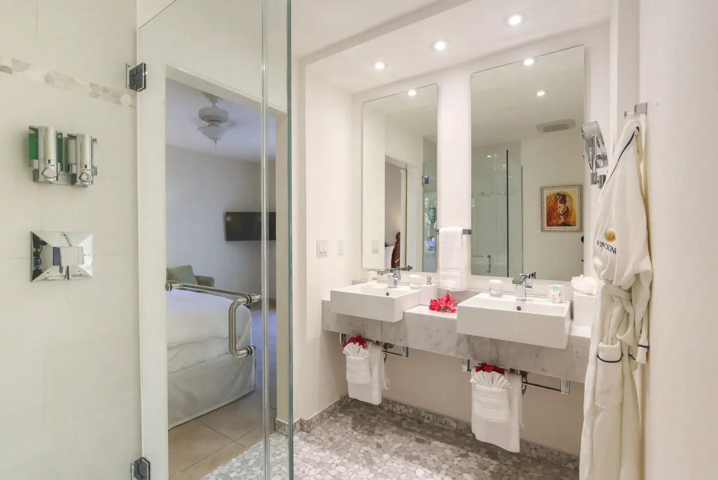 Two-bedroom bungalow bathroom with dual sinks at Windsong on the Reef.