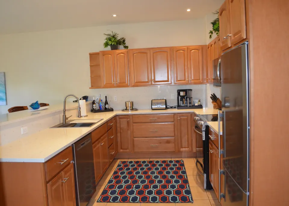 Bungalow three-bedroom kitchen with wood cabinets at Windsong on the Reef.