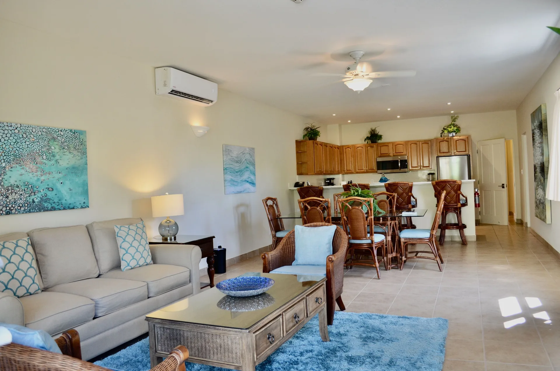 Bungalow three-bedroom living, dining, and kitchen area at Windsong on the Reef.
