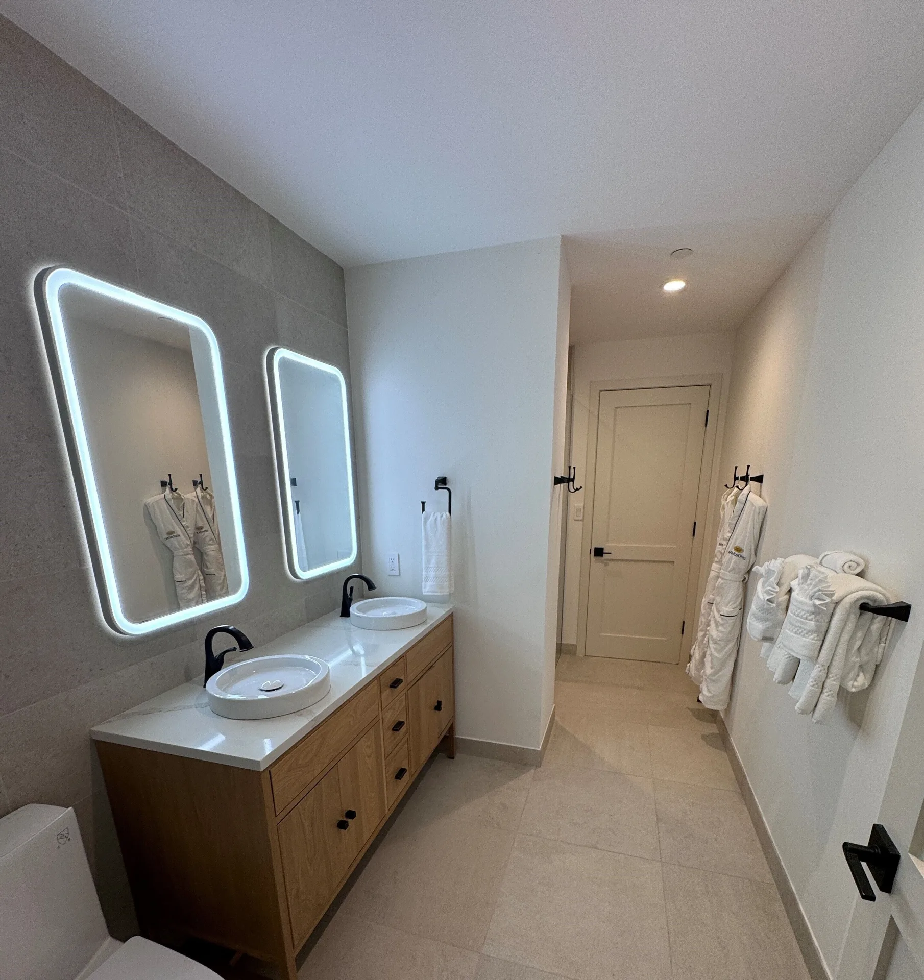 Junior Suite bathroom vanity with double sinks at Windsong on the Reef.