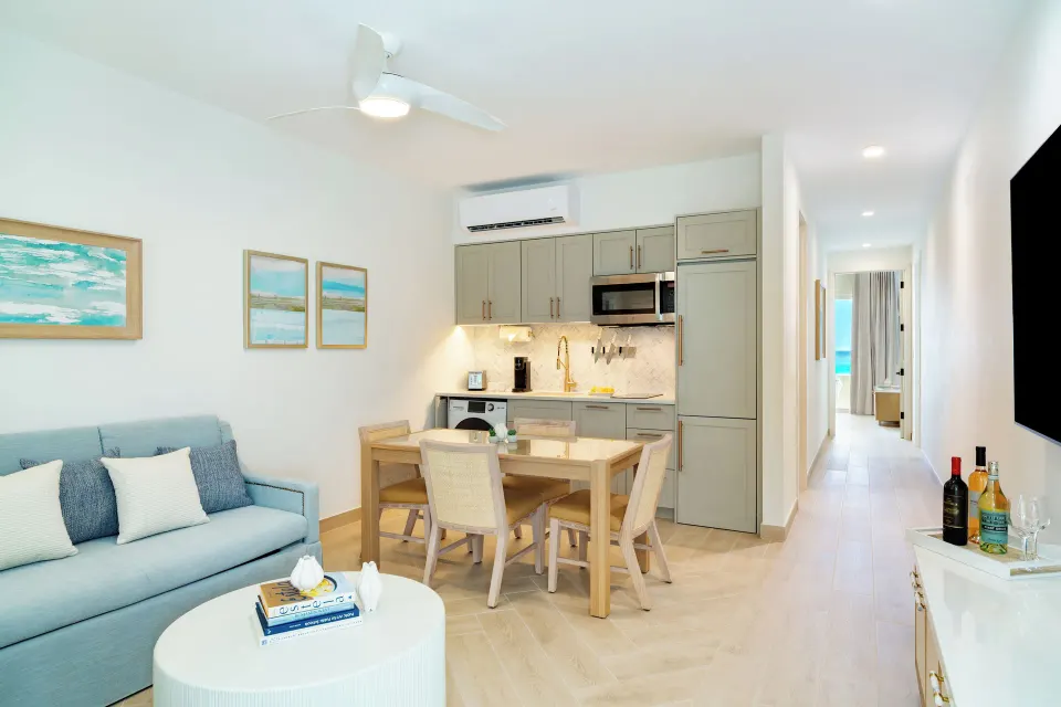 Junior Suite living area with kitchenette and dining table at Windsong on the Reef.