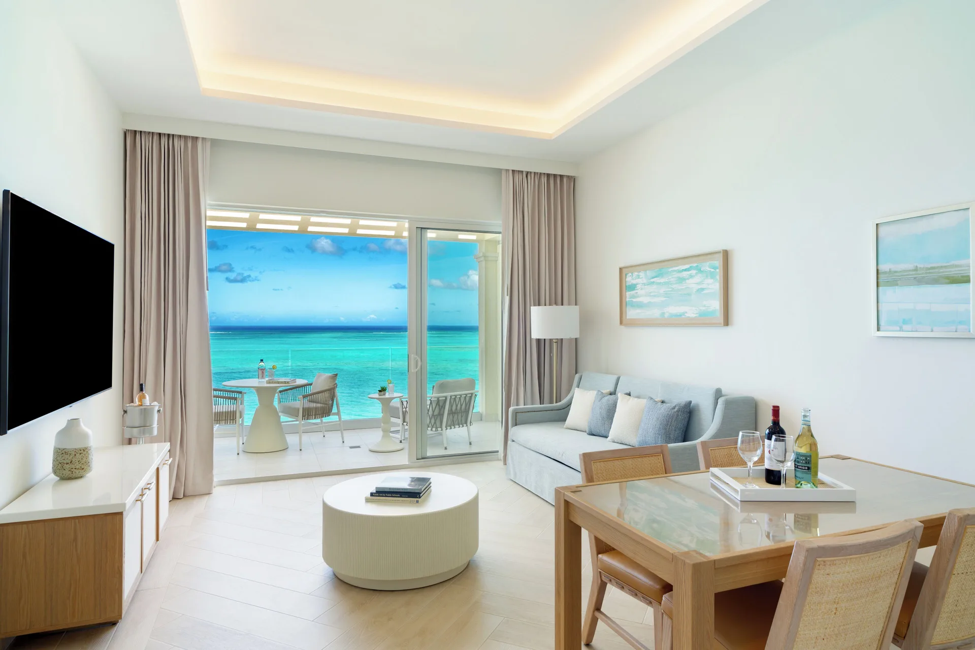 Junior Suite living room with oceanfront balcony at Windsong on the Reef.