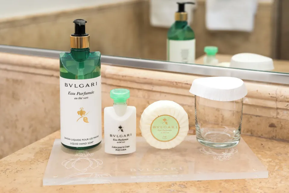 Studio bathroom amenities on a stone counter at Windsong on the Reef.