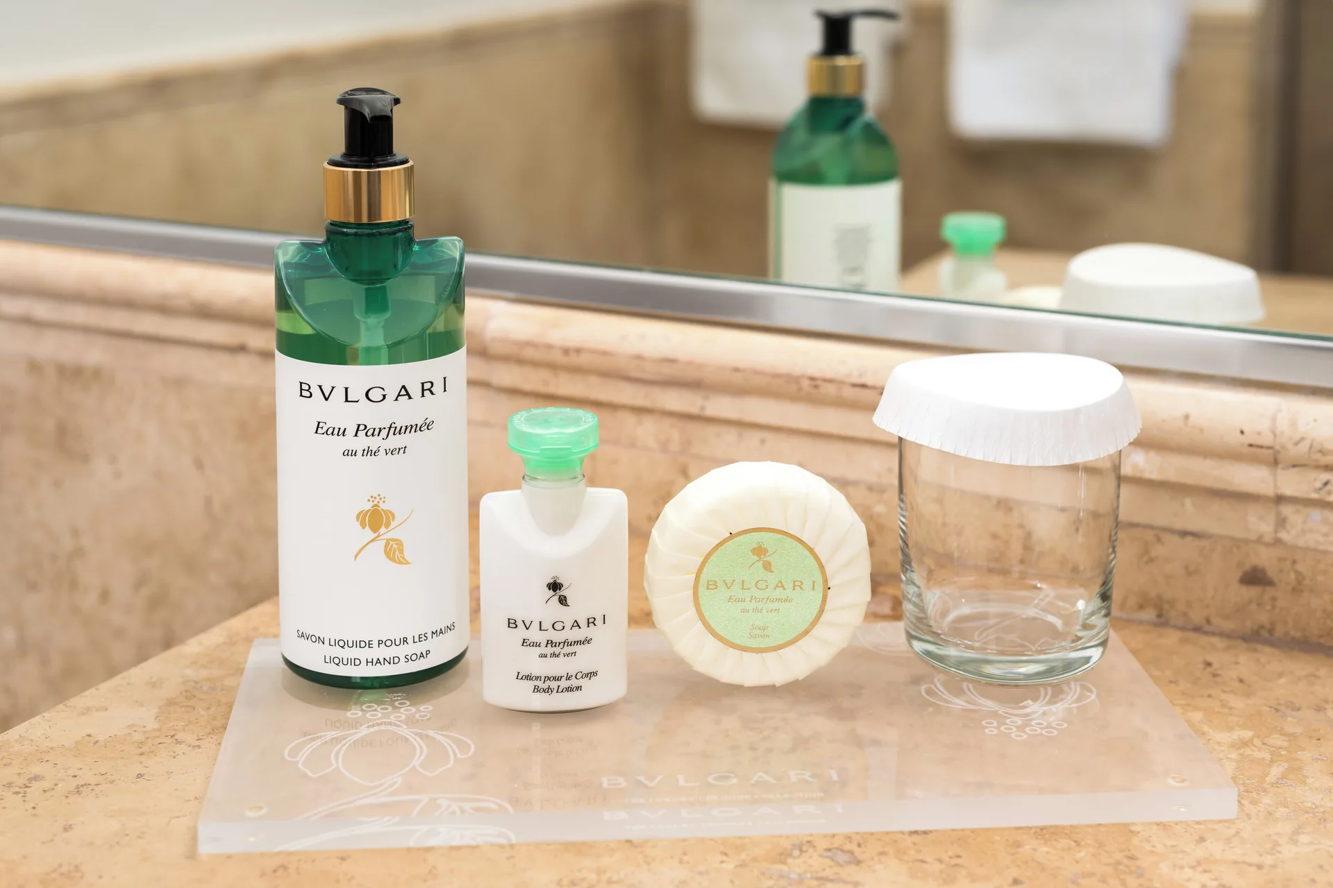 Studio bathroom amenities on a stone counter at Windsong on the Reef.